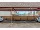 View of covered parking in a fenced in lot at 1585 S Holly St # 109, Denver, CO 80222
