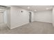 View of the finished basement with carpet at 7555 E 22Nd Ave, Denver, CO 80207