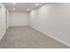 Spacious finished basement with neutral carpet and recessed lighting at 7555 E 22Nd Ave, Denver, CO 80207