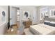 Cozy bedroom featuring a work desk, stylish decor, and natural light streaming through the window at 7555 E 22Nd Ave, Denver, CO 80207