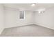 Basement bedroom with neutral paint, carpet and updated lighting at 7555 E 22Nd Ave, Denver, CO 80207