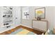 Charming bedroom with built-in shelving and stylish decor at 7555 E 22Nd Ave, Denver, CO 80207