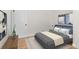 Comfortable bedroom featuring art, warm colors, and natural light at 7555 E 22Nd Ave, Denver, CO 80207