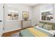 Inviting bedroom with ample natural light, hardwood floors, and modern decor at 7555 E 22Nd Ave, Denver, CO 80207
