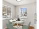 Charming dining area with a round table, stylish chairs, and bright windows, perfect for Gathering meals at 7555 E 22Nd Ave, Denver, CO 80207
