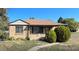 Charming single-story home with a brick exterior and a well-maintained front yard, perfect for a Gathering at 7555 E 22Nd Ave, Denver, CO 80207