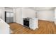 Modern kitchen with stainless steel appliances and a bright, open floorplan at 7555 E 22Nd Ave, Denver, CO 80207