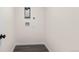 Functional laundry room area with hookups, modern flooring, and clean white walls at 7555 E 22Nd Ave, Denver, CO 80207