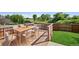 Outdoor deck with dining area, perfect for entertaining, with green yard and treed view at 1791 S Laredo St, Aurora, CO 80017