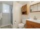 Well-maintained bathroom with a shower, vanity, and cabinet, offering practical features for daily use at 1791 S Laredo St, Aurora, CO 80017