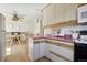 Bright kitchen with retro pink countertops and an adjacent dining area at 1791 S Laredo St, Aurora, CO 80017
