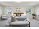 Serene bedroom features a king-sized bed, plush carpeting, and windows offering ample natural light at 1791 S Laredo St, Aurora, CO 80017