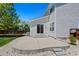 The backyard patio overlooks a well-maintained lawn with gravel accents at 16256 E Otero Pl, Englewood, CO 80112