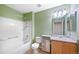 Bright bathroom featuring a shower-tub combo, and wood vanity at 16256 E Otero Pl, Englewood, CO 80112