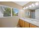 Well-lit bathroom with double sinks and vanity at 16256 E Otero Pl, Englewood, CO 80112