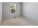 Neutral-toned bedroom with plush carpeting and a window for natural light at 16256 E Otero Pl, Englewood, CO 80112