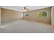 Expansive main bedroom with a ceiling fan and large windows for natural light at 16256 E Otero Pl, Englewood, CO 80112