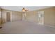 Spacious main bedroom with two entry doorways and a ceiling fan at 16256 E Otero Pl, Englewood, CO 80112