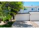 Inviting townhome with attached garage, mature shade tree and lush green lawn at 16256 E Otero Pl, Englewood, CO 80112
