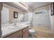 Cozy bathroom featuring a vanity, toilet, bathtub and bright tiled walls at 3844 S Gibralter St, Aurora, CO 80013