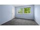 Bright bedroom with a light blue accent wall and large windows offering a serene view at 3844 S Gibralter St, Aurora, CO 80013