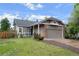Charming single Gathering home featuring a covered porch, brick accents, and an attached two car garage at 3844 S Gibralter St, Aurora, CO 80013