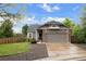 A well maintained single Gathering home with brick accents, a two car garage and manicured lawn at 3844 S Gibralter St, Aurora, CO 80013