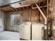 Utility room featuring side-by-side washer and dryer, as well as a window for natural light at 3844 S Gibralter St, Aurora, CO 80013
