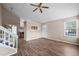 Living room featuring hardwood floors, vaulted ceilings, staircase and view of the kitchen and backyard at 3844 S Gibralter St, Aurora, CO 80013