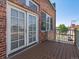 Charming balcony with a wooden deck and brick exterior, perfect for enjoying the outdoors at 225 N Lincoln St # 4, Denver, CO 80203