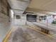 Spacious basement garage with cement floor, block walls, and industrial metal features at 225 N Lincoln St # 4, Denver, CO 80203