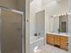 Relaxing bathroom featuring double sinks, tub and a separate glass-enclosed shower at 225 N Lincoln St # 4, Denver, CO 80203