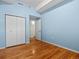 A bright bedroom with blue walls and wood floors at 225 N Lincoln St # 4, Denver, CO 80203
