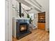 Living room with a fireplace, wood floors and stairway at 225 N Lincoln St # 4, Denver, CO 80203