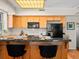 A bar top kitchen with black appliances and hardwood floors at 225 N Lincoln St # 4, Denver, CO 80203