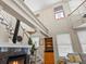 Living room featuring a granite fireplace, open stairs, and built-in shelving at 225 N Lincoln St # 4, Denver, CO 80203