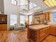 Bright, open loft featuring a living area with hardwood floors, exposed brick, and natural light streaming in from the windows at 225 N Lincoln St # 4, Denver, CO 80203