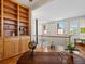 Home office featuring a dark wood desk and built-in shelving at 225 N Lincoln St # 4, Denver, CO 80203