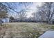 Large fenced backyard with grass, shed, and trampoline at 2482 Purcell Pl, Brighton, CO 80601