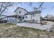 Spacious backyard with patio, lush grass, and mature trees at 2482 Purcell Pl, Brighton, CO 80601