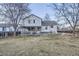Spacious backyard with lush green grass and mature trees at 2482 Purcell Pl, Brighton, CO 80601