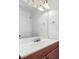 Well-lit bathroom featuring a sink with cabinet, a vanity with light and a mirror at 2482 Purcell Pl, Brighton, CO 80601