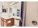 Bright bathroom featuring a vanity with cabinets and a combination shower and bathtub at 2482 Purcell Pl, Brighton, CO 80601