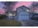 Charming two-story home featuring a two car garage, stone accents and beautifully landscaped front yard at 2482 Purcell Pl, Brighton, CO 80601