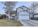 Charming two-story home featuring a two car garage, stone accents and beautifully landscaped front yard at 2482 Purcell Pl, Brighton, CO 80601