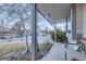 Inviting front porch view showcasing neighborhood street and a cozy spot for relaxing outdoors at 2482 Purcell Pl, Brighton, CO 80601