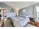 Comfortable main bedroom showcasing calming gray tones, large windows, and a peaceful atmosphere at 2482 Purcell Pl, Brighton, CO 80601