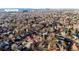 Aerial view of a Denver neighborhood with tree coverage, close to Wash Park with views of the city at 1035 S Elizabeth St, Denver, CO 80209