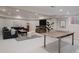 Spacious finished basement with a ping pong table, TV, and comfortable seating area at 1035 S Elizabeth St, Denver, CO 80209