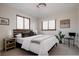 Comfortable bedroom offers natural light from two windows and modern accents at 1035 S Elizabeth St, Denver, CO 80209